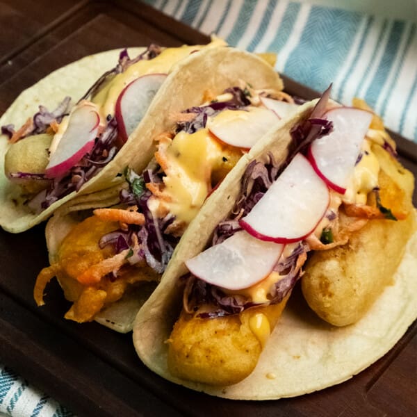 Crispy Baja-Inspired Fish Tacos with Zesty Slaw & Sriracha Dressing